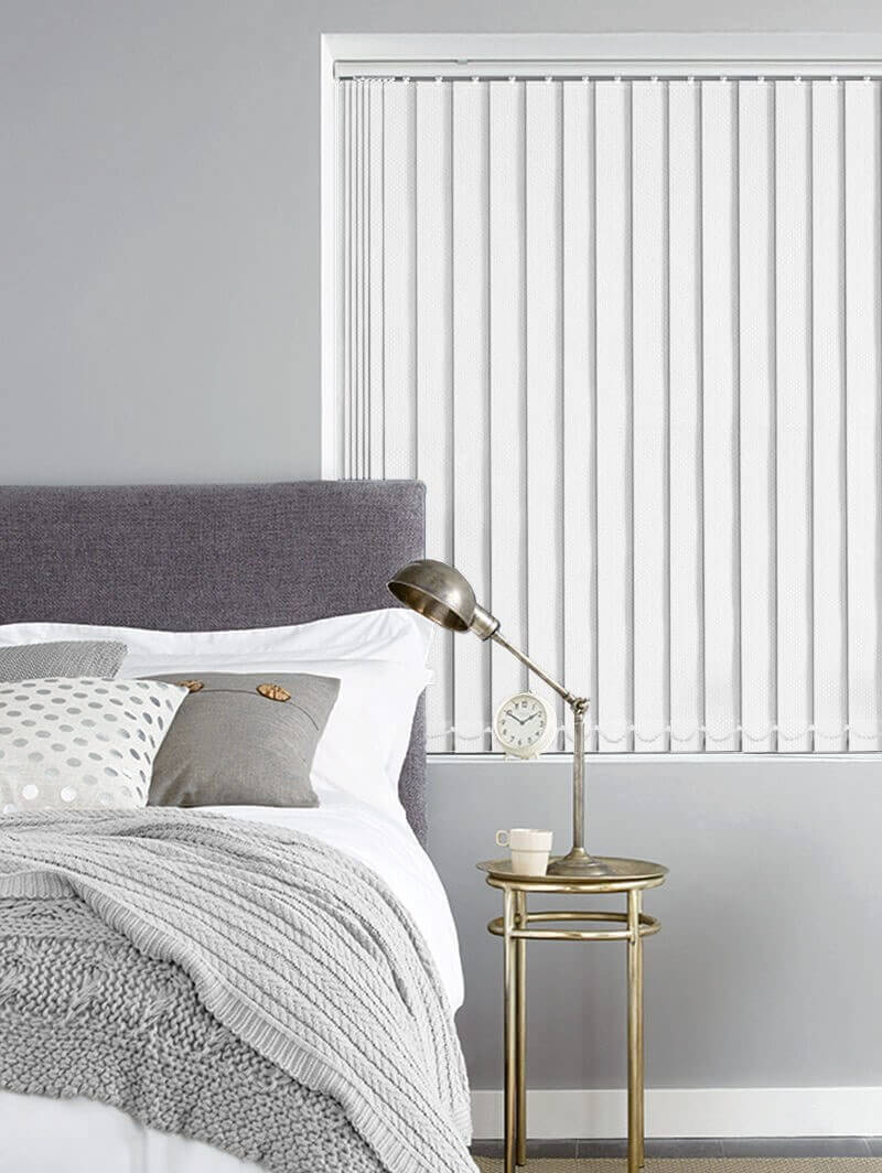 Bedroom with vertical blinds